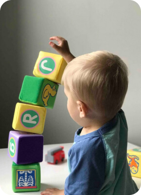 Small child playing with blocks