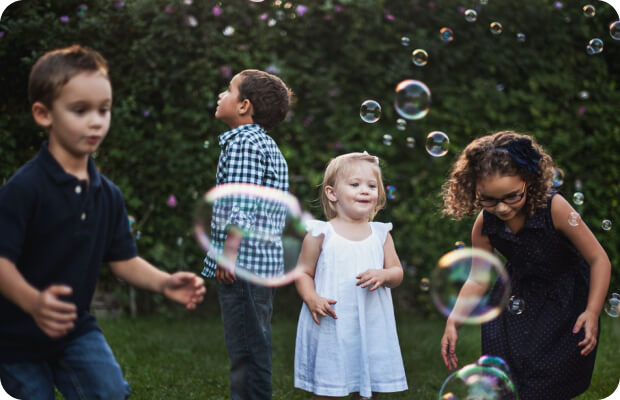 day-care-home-gallery-image-6.jpg Children playing with bubbles