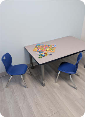 Maximum Potential Interior 2 Table with children's chairs and a puzzle for skills development