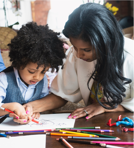 ABA teacher and student Applied Behaviour Analysis teacher with male student drawing