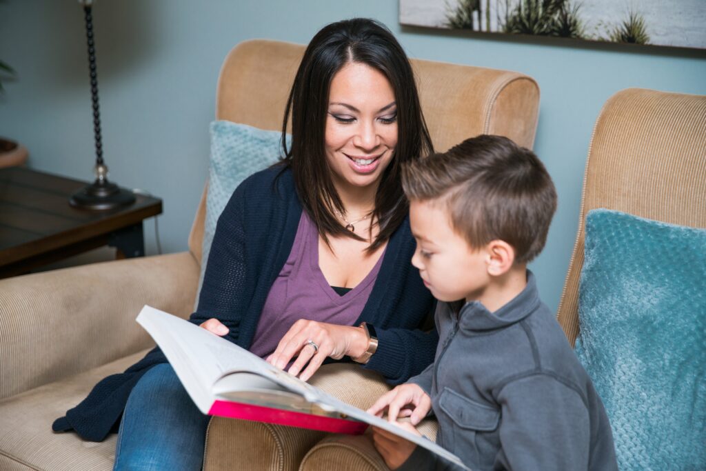 Child reading with parent